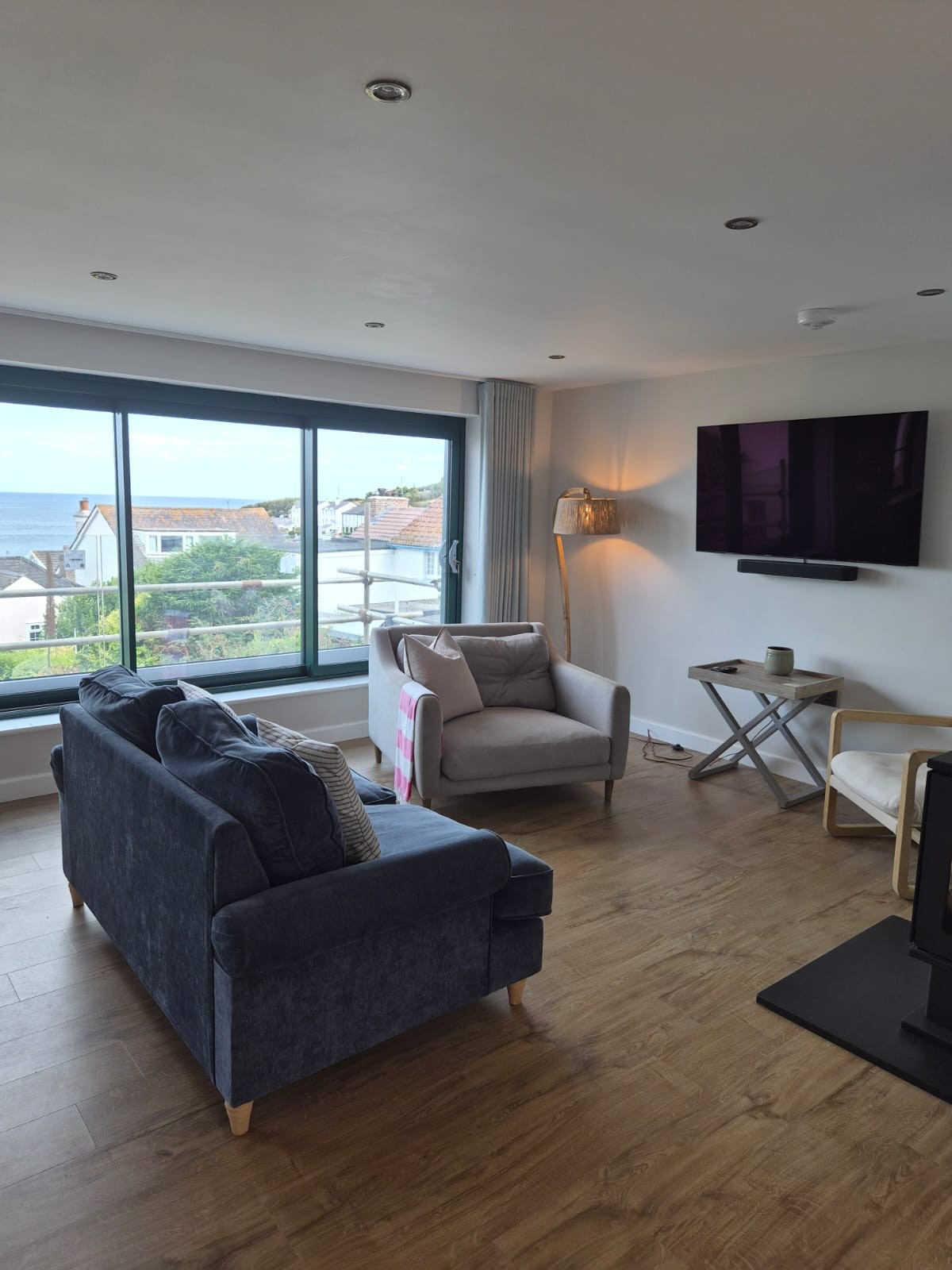 3 Parc Merys living room with broad windows looking towards the village