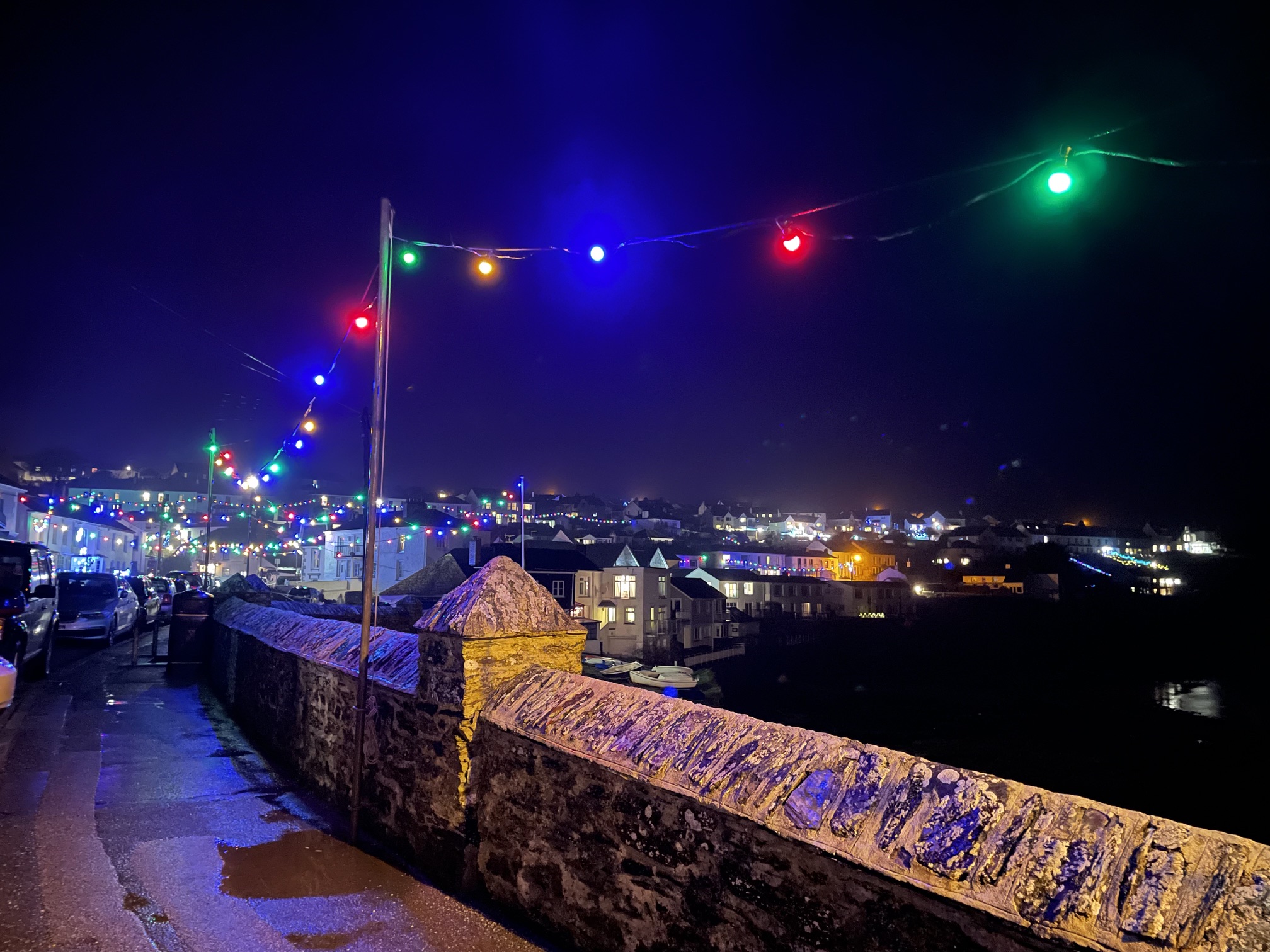Christmas lights glowing along Portscatho harbour